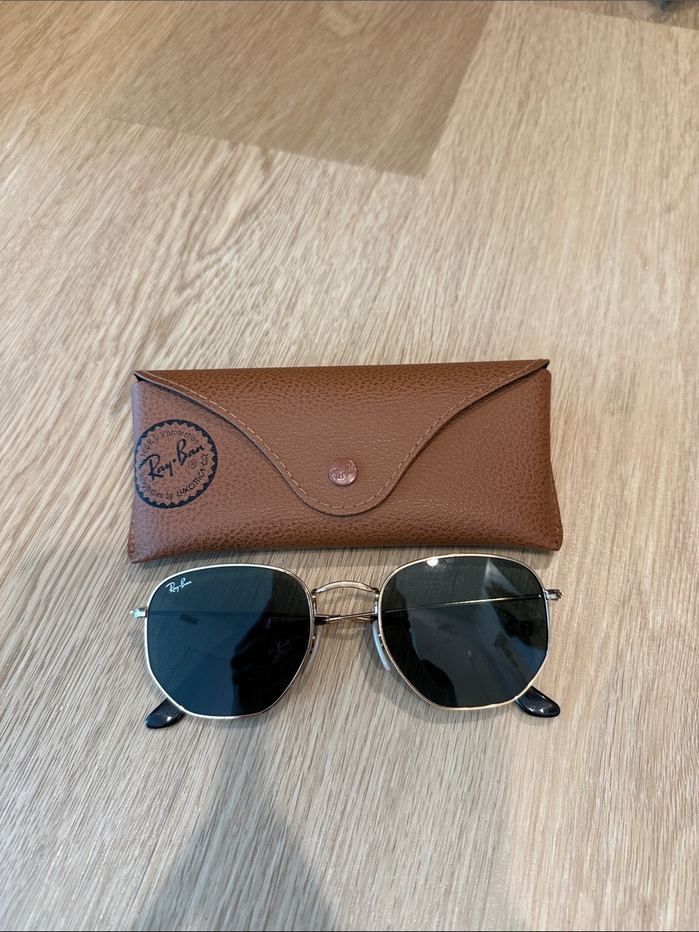 Ray-Ban Sunglasses with Black Lenses and Gold Frame